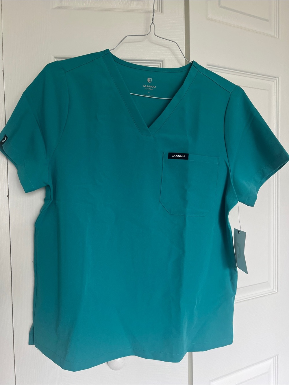 Jaanuu Women’s V-Neck Scrub Top in Teal Rhena Top NWT